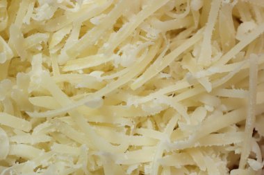 Rendelenmiş peynir arka planı. Parmesan dolgu dokusu.