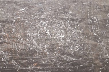 Buruşmuş selofan dokusu. Plastik ışık yansıması arka plan.