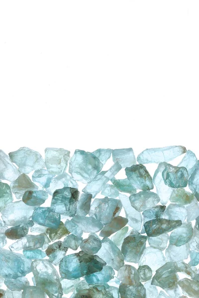 Apatite heap jewel stones texture on half white light isolated background. Place for text.