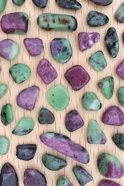 Ruby Zoisite Rare Jewel Stones Texture Light Varnished Wood Background — Stockfoto