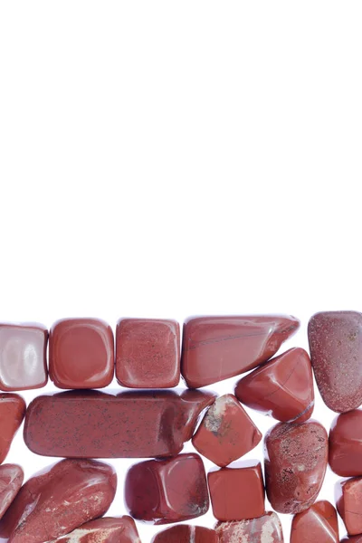 Red Jasper Heap Jewel Stones Texture Half White Light Isolated — Stockfoto