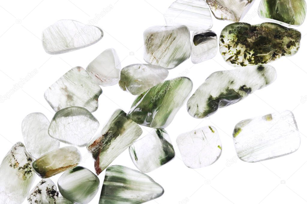 Green rutilated heap jewel stones texture on white light background