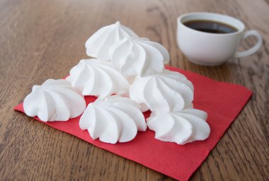 White french meringue cake with a cup of coffee