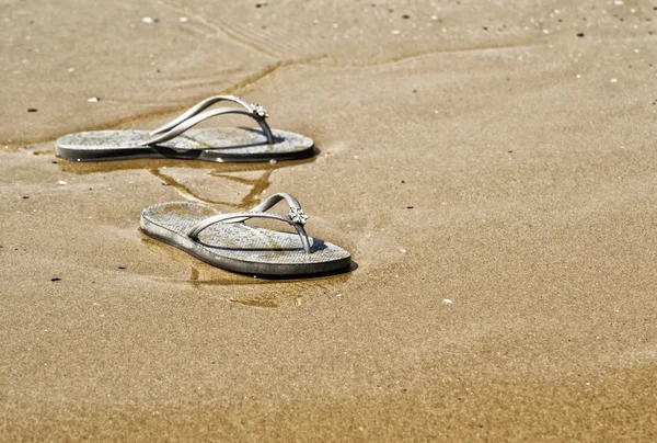 Summer shoes on the beach Stock Photo