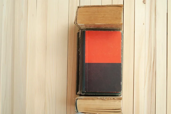 Stack of hardback books on wooden table. Back to school. Copy space — Stock Photo, Image