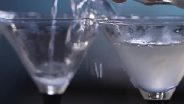 Pouring into martini glasses — Stock Video