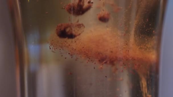 Closeup of cinnamon floating in a cocktail — Stock Video
