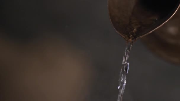 Pouring water from a carafe — Stock Video