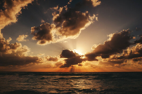 Landscape of amazing sunset, sunrise over the sea with dramatic sky clouds. Sunrise shot on the beach