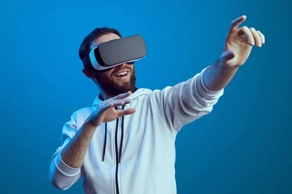 Amazed young male touching the air during the VR experience — Stock Photo, Image