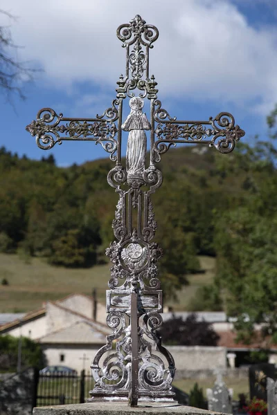 cross of the Catholic religion in front of a natural landscape