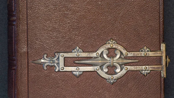 Detail of an old leather and metal book cover