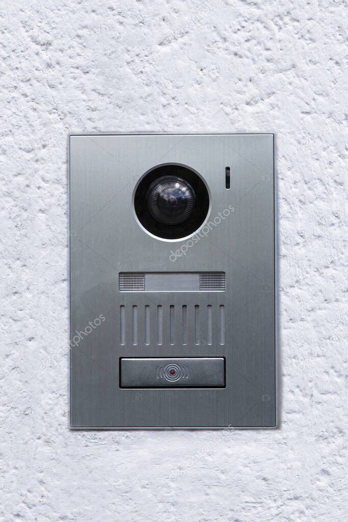 Close-up of a house bell with intercom and surveillance camera