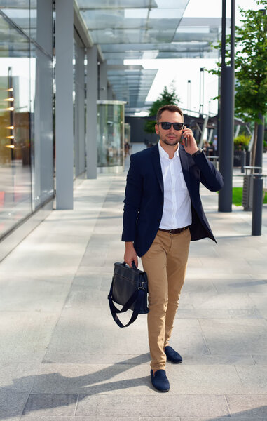 Businessman walking down the street with a briefcase