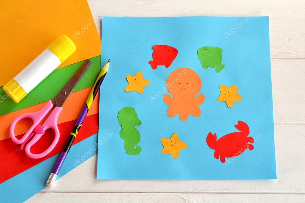 Paper sea animals on blue card. Glue stick, scissors, pencil, colored paper. Preschool and kindergarten paper crafts. DIY project. Kindergarten activity Stock Photo by ©OnlyZoia 112252206 Paper sea animals on blue card. Glue stick, scissors, pencil, colored paper. Preschool and kindergarten paper crafts. DIY project. Kindergarten activity Stock Photo by ©OnlyZoia 112252206