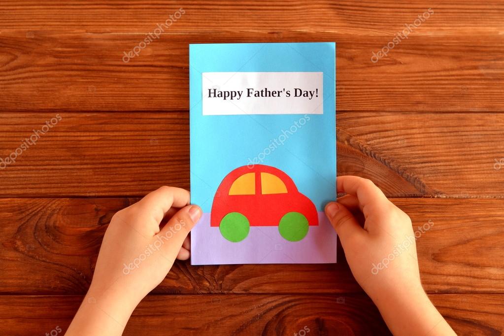 Greeting card father's Child holds a greeting card in his