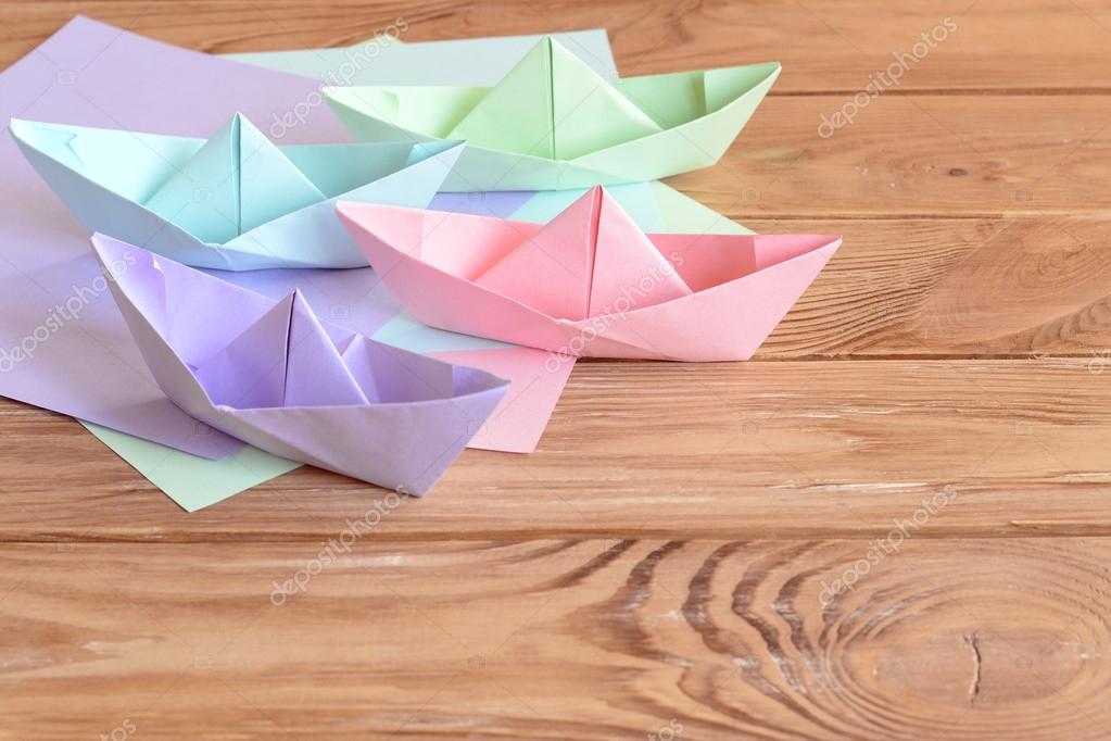 Pink Green Blue Lilac Paper Boats Toys On Wooden Background