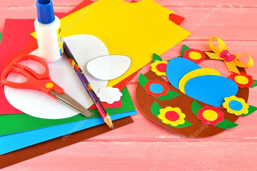 Sheets of colored paper, scissors, glue, pencil, Easter basket and eggs -  set for children art Stock Photo by ©OnlyZoia 116684520