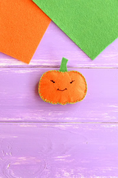 Halloween cute orange pumpkin on wooden background with blank place for text. Halloween children background. Handmade felt pumpkin decor — Stock Photo, Image