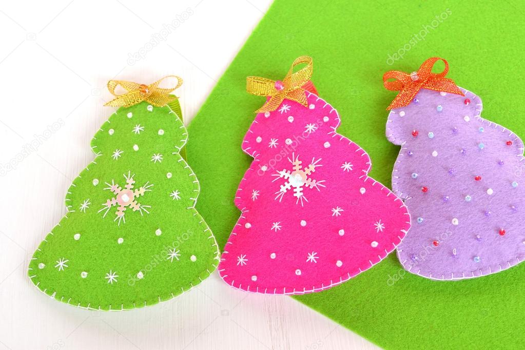 Pink, green and purple felt Christmas trees. Christmas tree ornaments