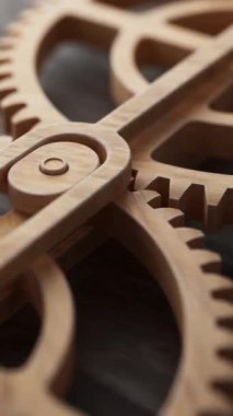 Mekanik bir şafta bağlı iki ahşap dişlinin animasyonu. Döngülü hareket. Yakın plan. Odaklanmayın