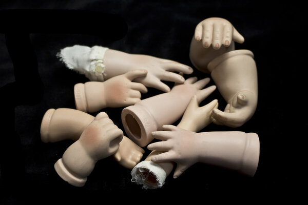 Doll Hands Body Parts on Black Background
