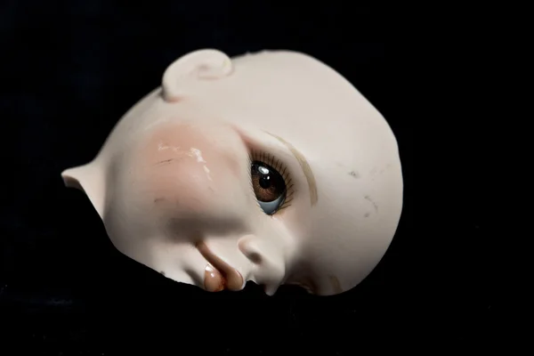 Close Up of Broken Doll Heads and Parts On Black Background — Stock Photo, Image