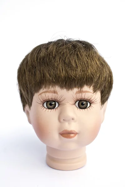 Kleiner Junge Puppe Kopf auf weißem Hintergrund — Stockfoto