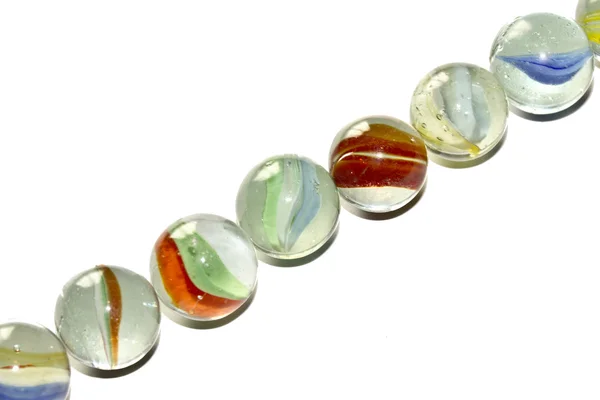 Multicolored glass marbles On a White Background — Stock Photo, Image
