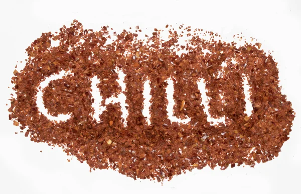 Red Chilli Spice Flakes em fundo branco — Fotografia de Stock