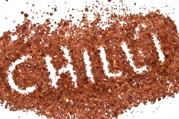 Red Chilli Spice Flakes em fundo branco — Fotografia de Stock