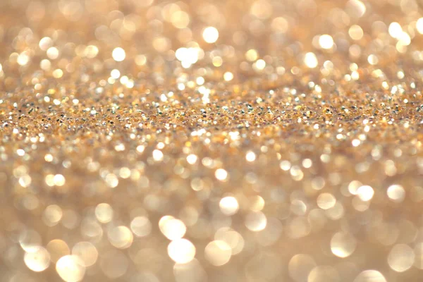 Odaklanma ve bokeh ile altın parıltılı arkaplan