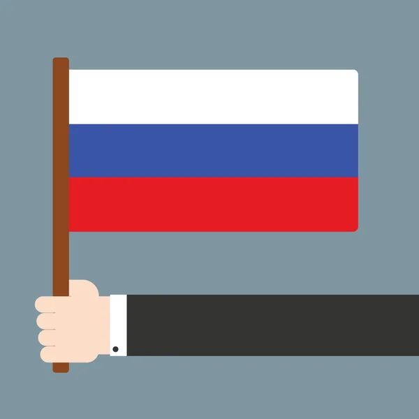 Mano sosteniendo bandera rusa — Vector de stock