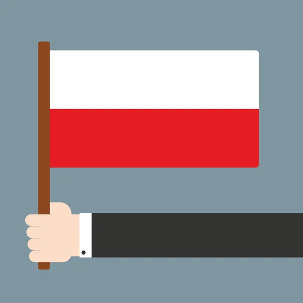 Hand holding poland flag — Stock Vector