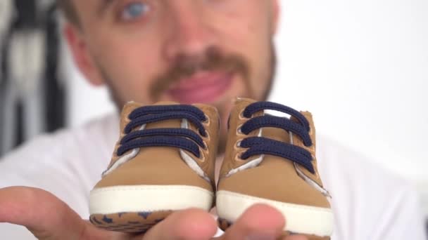 Slow Motion Cropped Image Man Holding Newborn Shoes Bedroom — Stock Video