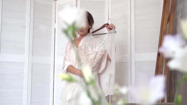 Bride Silk Dressing Gown Holding Admiring Her Beautiful Wedding Dress — Stock Video