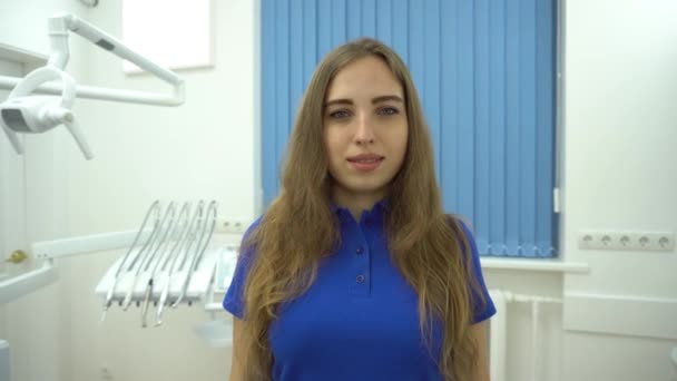 Happy Young Female Dentist Medical Office Background — Stock Video