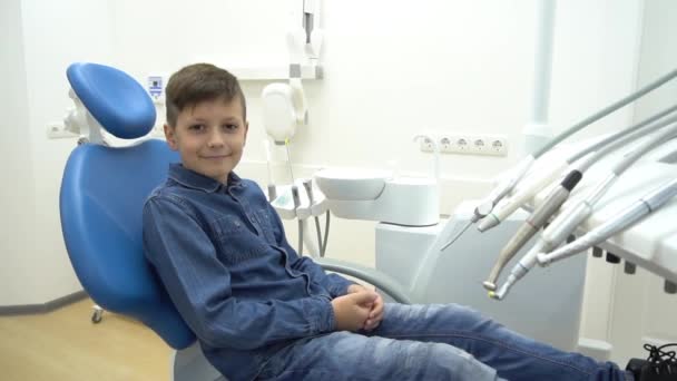 Boy Sitting Dentist Chair Showing Thumbs — Stock Video