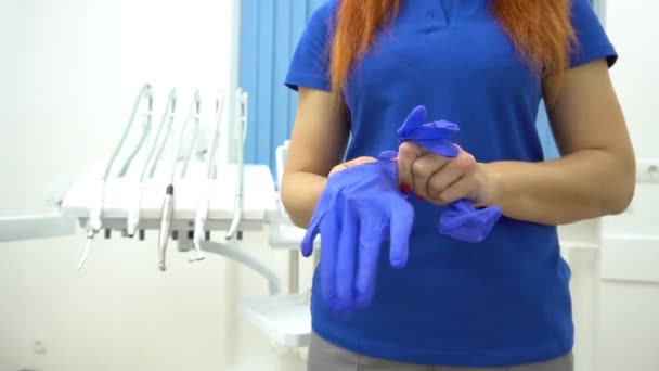 Female Dentist Dental Office Puts Gloves — Stockvideo