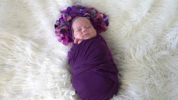 Slow Motion Newborn Baby Girl Wearing Purple Headband Flowers — Stock Video