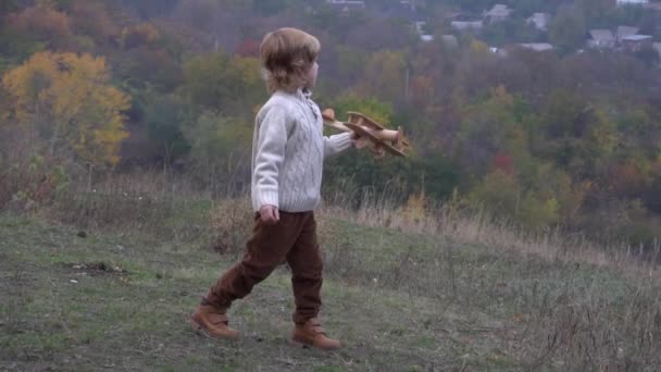 Slow Motion Cute Little Boy Pilot Suit Playing Toy Plane — Stock Video