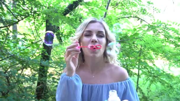 Slow Motion Woman Blowing Soap Bubbles — Video