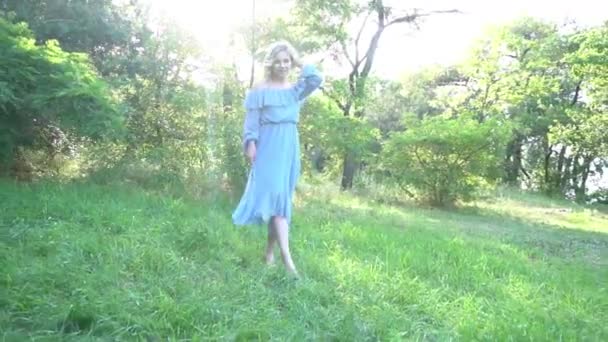 Beautiful Young Woman Blonde Denim Overalls Walks Summer City Park — Video