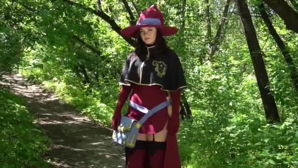 Girl Dressed Witch Casts Spell Front Forest — Stock video