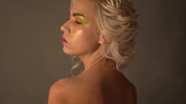 Slow Motion A close up portrait of a lovely mysterious girl. Beauty, cosmetics.