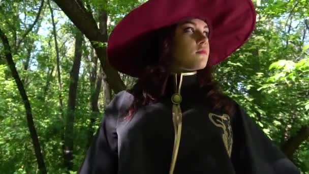 Witch Burgundy Clothes Walks Forest — Stockvideo