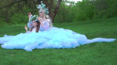 Slow Motion The princesses are dressed in luxurious long dresses