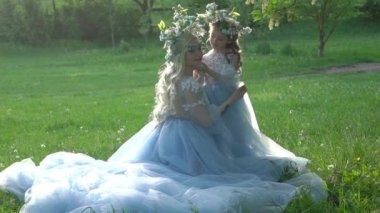 Slow Motion Woman princess in family look blue dress long train medieval