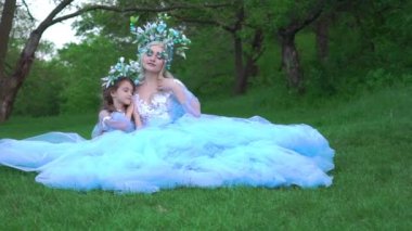Slow Motion Woman princess in family look blue dress long train medieval