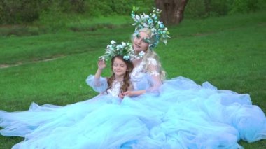 Slow Motion Mom loves her child. Family look romantic similar dresses. 